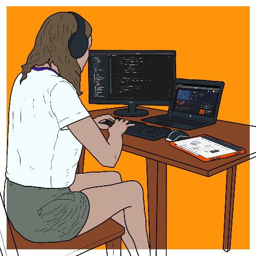 Set up of Lowri Roberts work area.  She is wearing headphones while working on a laptop with a second monitor. She has a ipad on side.